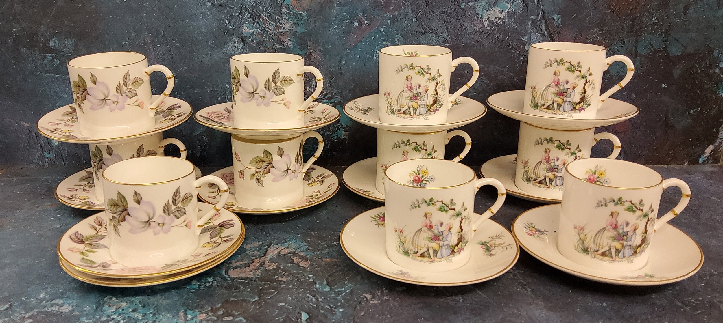 A set of six Royal Worcester Watteau pattern coffee cans and saucers, printed mark;  a set of five