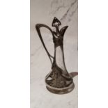 A W.M.F. liqueur decanter, applied with sinuous lines and foliage, 25cm high, c.1910