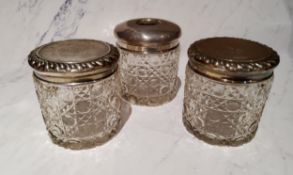 A pair of silver mounted hobnail cut dressing table jars, 7cm high, Birmingham, c.1920;  another,