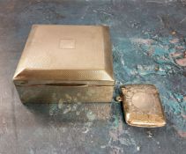 A silver rectangular cigarette box, cedar lined, 8.5cm wide, Birmingham 1926;   a silver vesta case,