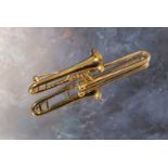 A 9ct gold novelty brooch in the form of a trombone approx. 7cms long 8.6g (VAT on Hammer price)