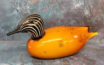 A Murano glass duck, with black and white striped head, mottled orange body, 30cm long, label