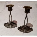 A pair of W.M.F. candlesticks, divided columns, shaped oval bases, 16cm high