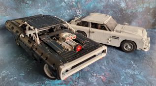 A Mould King Lego style Fast & Furious Dodge Charger, built; a James Bond 007 Aston Martin DB5,