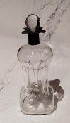 An Edwardian silver mounted and clear glass guglet decanter and stopper, 24cm high, Birmingham 1908