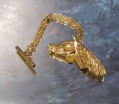 A 9ct gold horse head on a short chain with T-bar, JS, Sheffield 5.68g (VAT on Hammer price)