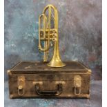 A brass trumpet, cased