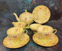 A Foley Bone China tea for two, pattern 2798, decorated with colourful flowers, light green borders,