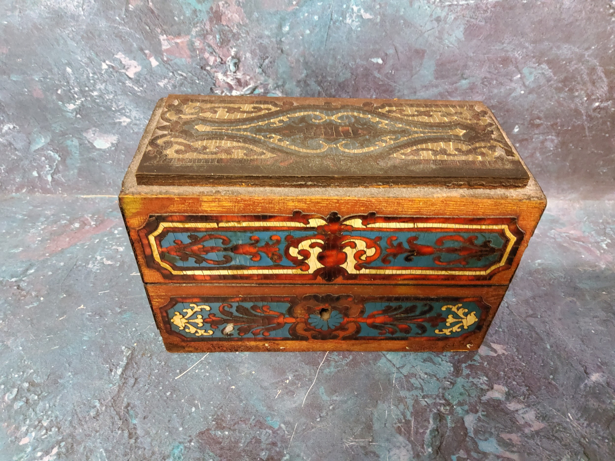 A 19th century French Boulle and ebonised scent casket,  enclosing three clear glass bottles