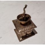 A Dutch silver coloured metal miniature coffee grinder, 5.5cm high