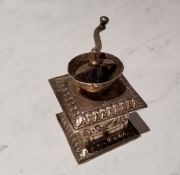 A Dutch silver coloured metal miniature coffee grinder, 5.5cm high