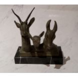 Art Deco, a green patinated bronze, deer family group, heads, rectangular marble base, 19cm high