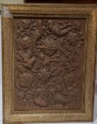 An Islamic copper panel, embossed with birds and foliage, Kahatan marquetry frame, 49cm x 39cm