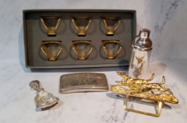 A set of six gilt metal napkin holders, boxed;  a Mappin and Webb miniature cocktail shaker, 10cm