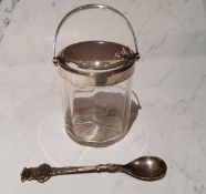 A silver mounted and clear glass preserve pot, swing handle opening hinged cover, 14cm high,