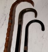 A silver mounted and horn ebonised walking stick, 87cm long;  others (3)
