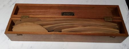 J Halden & Co Ltd - a set of pearwood draught's man curves, rectangular mahogany box