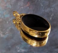 A 9ct gold mounted two-sided oval fob/pendant set with cornelian & black onyx approx. 4.5 x 2.