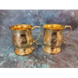 A pair of silver baluster mugs, gilt interiors, acanthus capped scroll handles, 9cm high, James