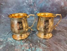 A pair of silver baluster mugs, gilt interiors, acanthus capped scroll handles, 9cm high, James