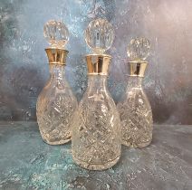 A pair of  silver mounted decanter, globular stoppers, 28cm high,  James Dixon & Sons, Birmingham,