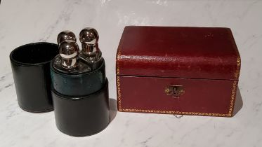 A 20th century three bottle cylindrical travelling cologne case, plated mounts, 13.5cm high;  an