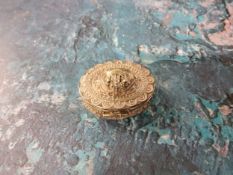 A silver coloured metal oval trinket box, embossed and cast overall with scrolls and beadwork, 3.5cm