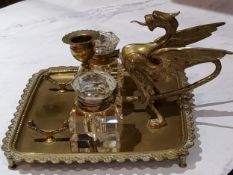 A  brass wyvern inkstand, of rounded square form, with two wells, the wyvern with wings