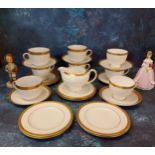 A Royal Worcester figure, Modesty, crown and circle mark;   a Wedgwood tea service, banded in