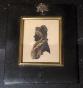 A Victorian silhouette, of a lady in a bonnet, highlighted in gilt, ebonised frame, 14.5cm x 12.5cm