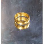 A 22ct gold wedding band, size U, 6.7g