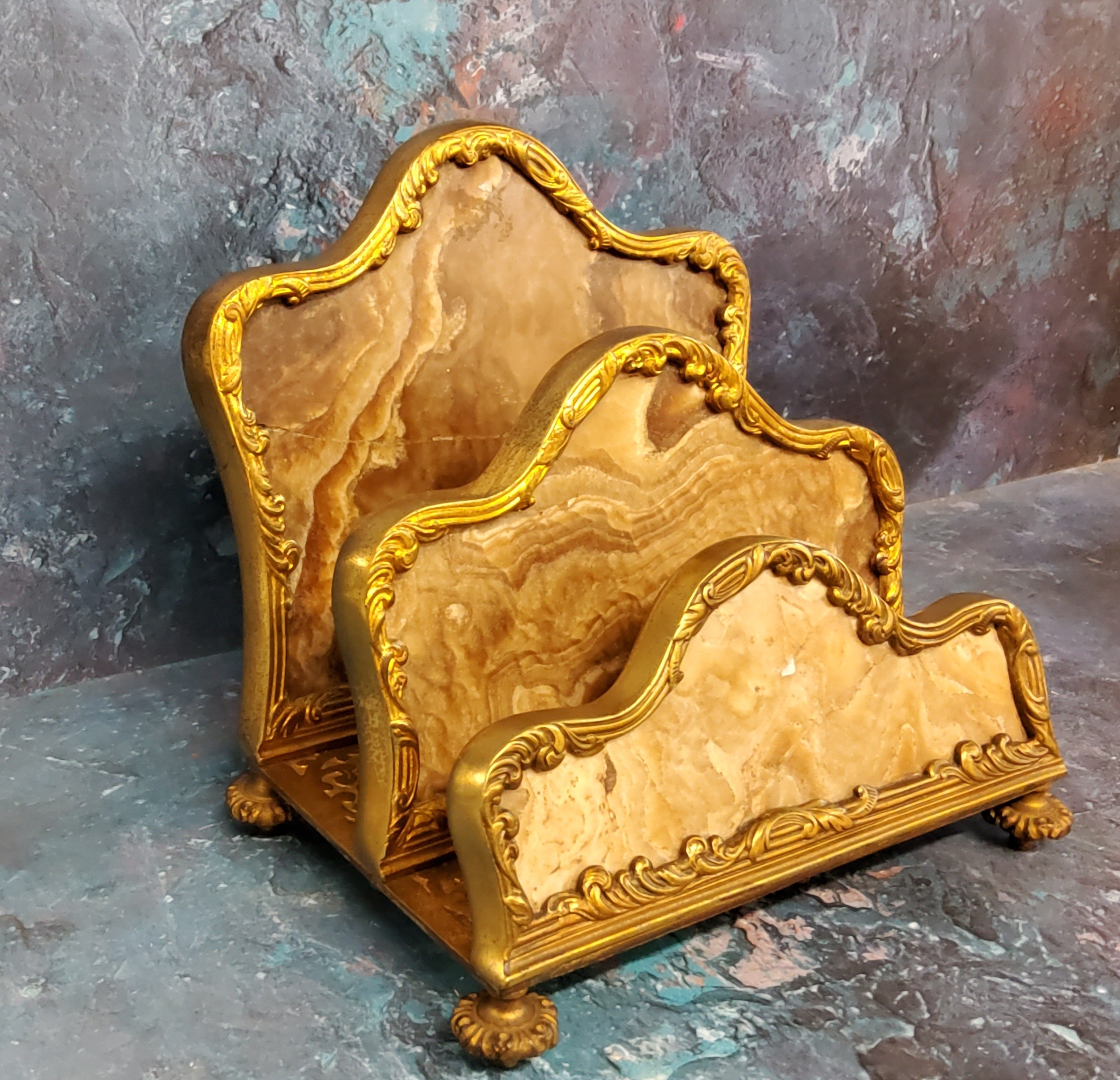 A French agate and gilt bronze two tier waterfall letter rack, cast with foliate scrolls, 18cm high,