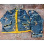 Oriental Textiles  - Chinese silk child's two-piece suit, embroidered in colours on a blue ground,