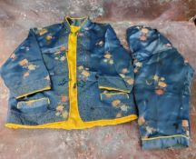 Oriental Textiles  - Chinese silk child's two-piece suit, embroidered in colours on a blue ground,