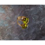 An 18ct gold and peridot dress ring (3.3g gross weight)