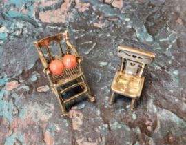 A silver miniature rocking chair, 3.25cm high;  a miniature kitchen chair (2)