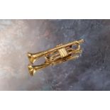 A 9ct gold novelty brooch in the form of a trumpet approx. 7cms long 10g (VAT on Hammer price)