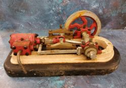 An early 20th century cast iron model engine, 48cm long