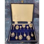A set of six sterling silver Mocha coffee spoons, terminating in an oval embossed in relief with
