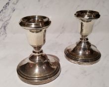 A pair of silver boudoir candlesticks, bell shaped sconces, 8.5cm high, Birmingham 1963