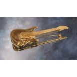 A 9ct gold novelty brooch in the form of an electric guitar approx. 5cms long 8.3g (VAT on Hammer