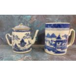 A late 18th/early 19th century  Chinese mug, decorated in underglaze blue with pagodas, bridge and