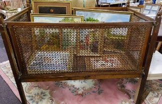 An early 20th century oak and bergere cot, 119cm high, 137cm wide,  c.1920