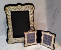 A silver shaped rectangular double folding photograph frame, 11cm high, 21cm wide, Elkington and Co,