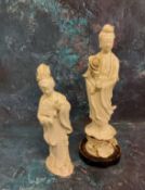 A 19th century Blanc de Chine figure, Guanyin, standing holding a lotus, 26cm high;  another,