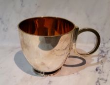 A silver cup, scroll handle, gilt interior, 7cm high, Boodle & Dunthorne, Sheffield 2000, 217g, 6.