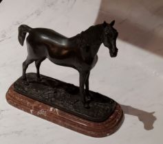After Mene, a dark patinated bronze,  horse standing, rouge marble base, 21cm high