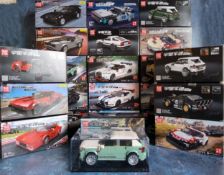 Mould King Lego style kits, some unbuilt & built, each complete with display case and instructions