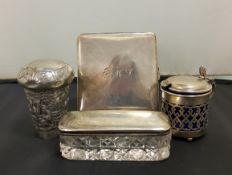 A silver cigarette case, Walker and Hall, Birmingham 1932;  a silver dressing table jar, 8cm long,