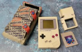 Retro gaming - a Nintendo Gameboy (missing battery cover), Tetris game cartridge, a Nuby Game Light;